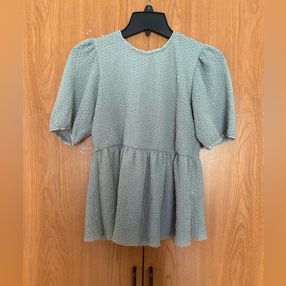 Jolt woman’s turquoise blouse